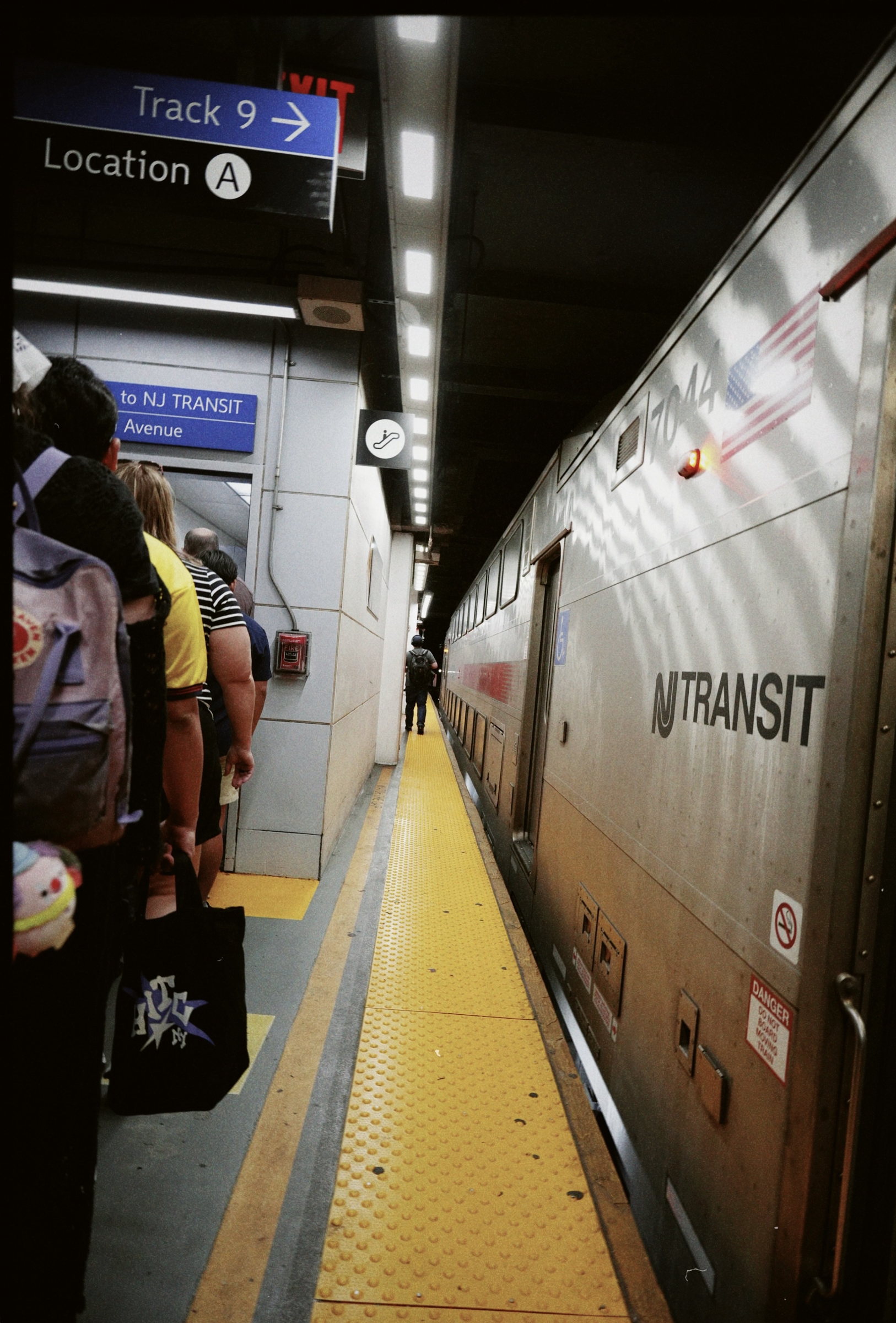Passengers waiting on a subway platform