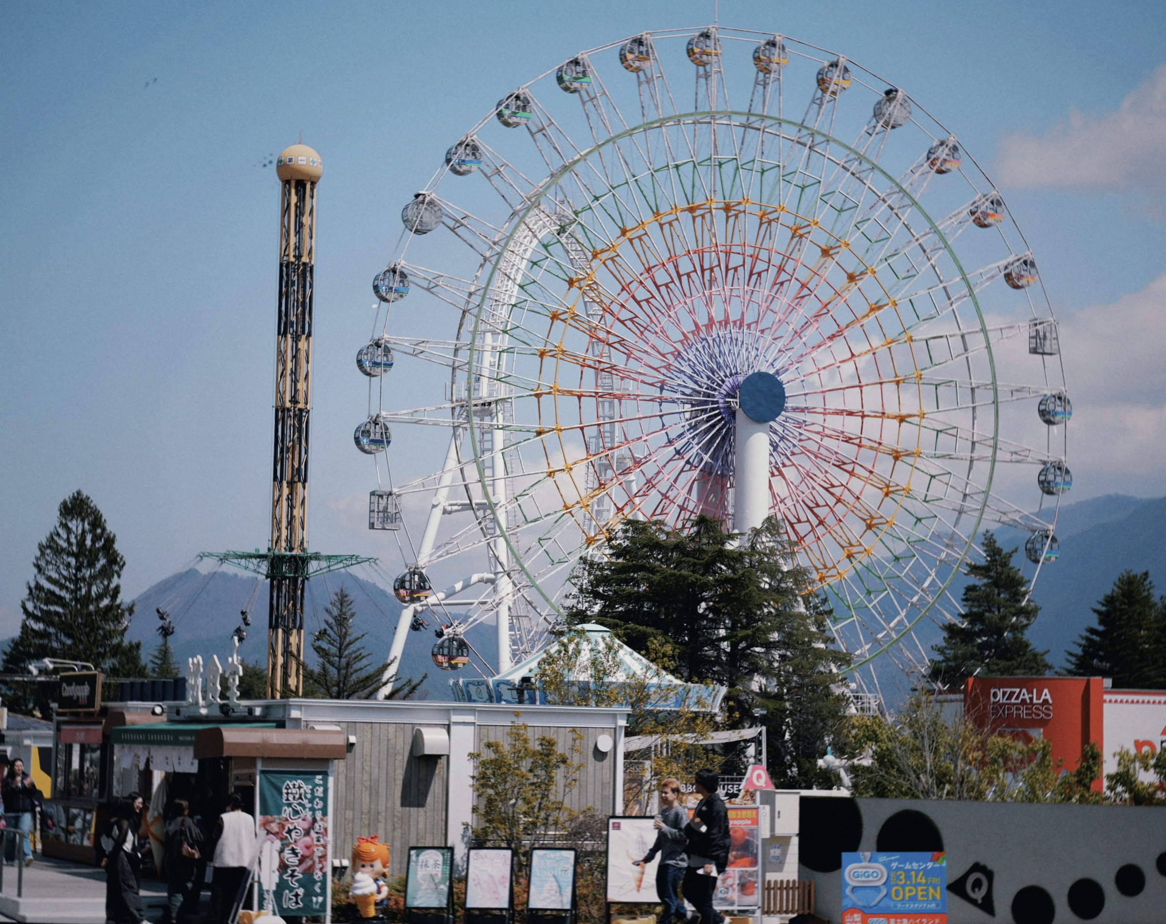 Ferris wheel beneath a clear blue sky